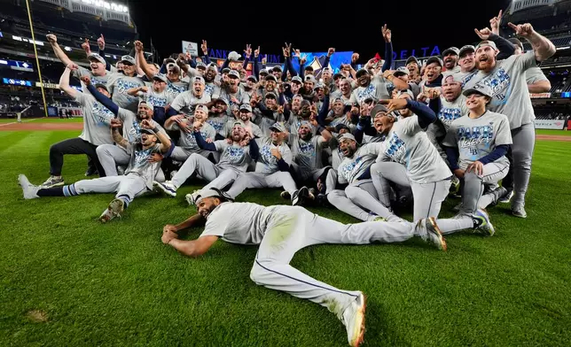The Tampa Bay Rays celebrate the team's win in Game 3 of baseball's American League Division Series against the New York Yankees, Wednesday, Oct. 7, 2026, in New York. (AP Photo/Yuki Iwamura)