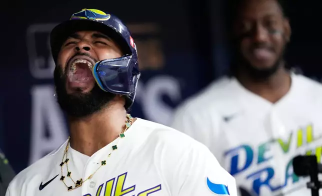 Tampa Bay Rays' Junior Caminero celebrates a two-run home run against the Cleveland Guardians during the seventh inning in Game 6 of an American League Championship Series baseball game in St. Petersburg, Fla. Monday, Oct. 19, 2026. (AP Photo/David J. Phillip)