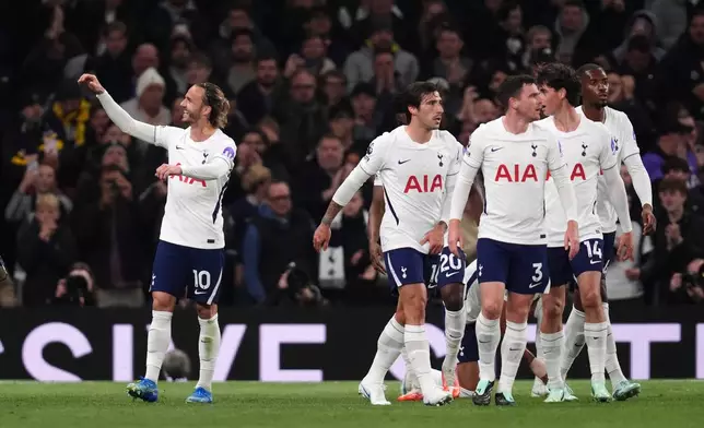 Tottenham Hotspur's James Maddison, left, celebrates scoring during the English Premier League soccer match between Tottenham Hotspur and Coventry City in London, Monday Oct. 19, 2026. (John Walton/PA via AP)