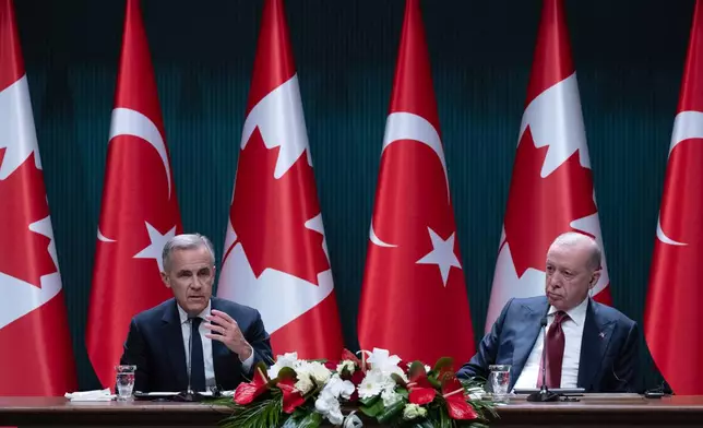 Turkish President Recep Tayyip Erdogan looks on as Prime Minister Mark Carney speaks during a joint-statement in Ankara, Turkey on Thursday, Oct. 22, 2026. (Adrian Wyld /The Canadian Press via AP)