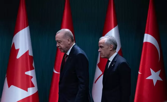 Prime Minister Mark Carney and Turkish President Recep Tayyip Erdogan take to the stage for a joint statement in Ankara, Turkey Thursday, Oct. 22, 2026. (Adrian Wyld /The Canadian Press via AP)
