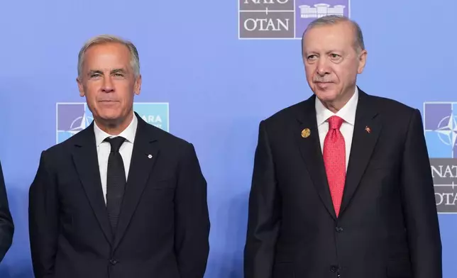 FILE - Canada's Prime Minister Mark Carney, left, and Turkish President Recep Tayyip Erdogan pose for a photo during the NATO summit in Ankara, Turkey, Wednesday, July 8, 2026. (AP Photo/Alex Brandon, File)