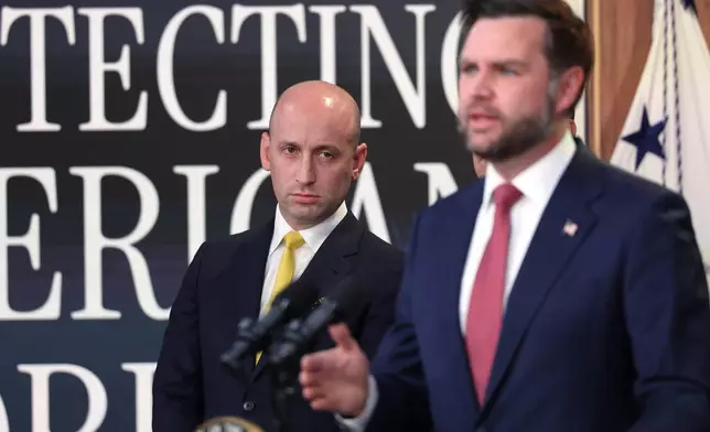 Stephen Miller, White House deputy chief of staff, listens as Vice President JD Vance speaks during a news conference on the Fraud Task Force inside the Eisenhower Executive Office Building on the White House campus, Thursday, Oct. 8, 2026, in Washington. (AP Photo/Tom Brenner)