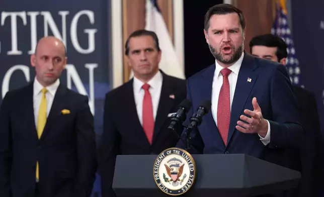 Vice President JD Vance speaks as Stephen Miller, White House deputy chief of staff, from left, and Attorney General Todd Blanche listen during a news conference on the Fraud Task Force inside the Eisenhower Executive Office Building on the White House campus, Thursday, Oct. 8, 2026, in Washington. (AP Photo/Tom Brenner)