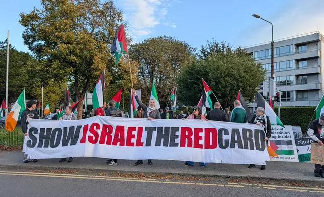 People call on the Football Association of Ireland to boycott Sunday's soccer game against Israel near the Aviva Stadium in Dublin on Thursday, Oct. 1, 2026. (Cillian Sherlock/PA via AP)