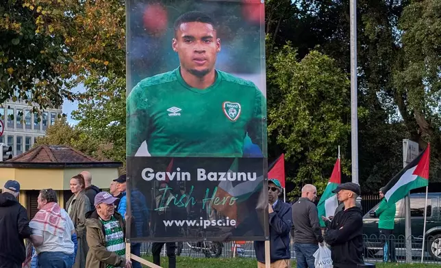 People call on the Football Association of Ireland to boycott Sunday's soccer game against Israel near the Aviva Stadium in Dublin on Thursday, Oct. 1, 2026. (Cillian Sherlock/PA via AP)
