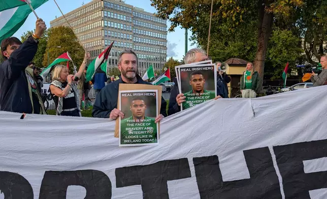 People call on the Football Association of Ireland to boycott Sunday's soccer game against Israel near the Aviva Stadium in Dublin on Thursday, Oct. 1, 2026. (Cillian Sherlock/PA via AP)