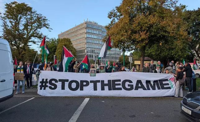 People call on the Football Association of Ireland to boycott Sunday's soccer game against Israel near the Aviva Stadium in Dublin on Thursday, Oct. 1, 2026. (Cillian Sherlock/PA via AP)