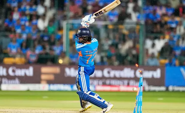 India's Tilak Varma is bowled out by West Indies' Shamar Springer during the fifth T20 cricket match between India and West Indies in Bengaluru, India, Saturday, Oct. 17, 2026. (AP Photo/Aijaz Rahi)