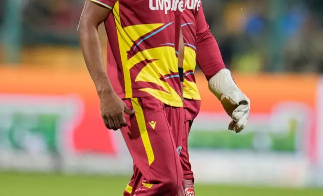 West Indies' captain Shai Hope, right, talks to his bowler Keemo Paul during the fifth T20 cricket match between India and West Indies in Bengaluru, India, Saturday, Oct. 17, 2026. (AP Photo/Aijaz Rahi)