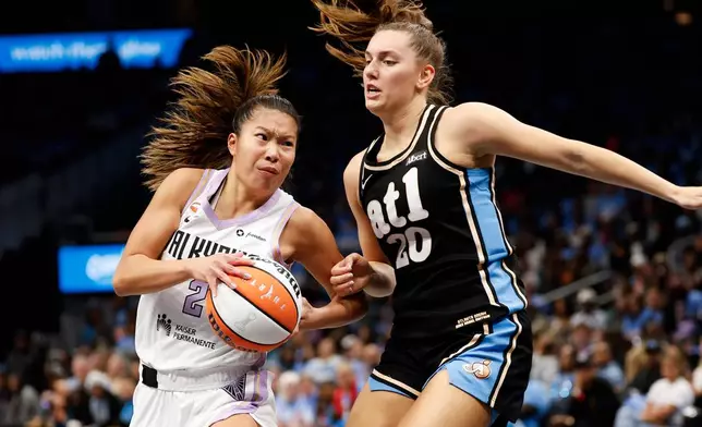 Golden State Valkyries guard Kaitlyn Chen (2) moves the ball while defended by Atlanta Dream guard Isobel Borlase (20) during the second half of Game 3 of the WNBA basketball finals on Wednesday, Oct. 21, 2026, in Atlanta. (Santiago Mejia/San Francisco Chronicle via AP)
