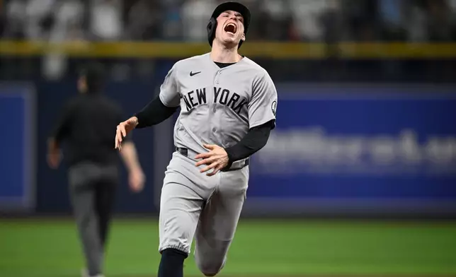 New York Yankees' Ben Rice reacts after teammate Cody Bellinger's fly out to end the top of the fifth inning in Game 2 of an American League Division Series baseball game against the Tampa Bay Rays Monday, Oct. 5, 2026, in St. Petersburg, Fla. (AP Photo/Phelan Ebenhack)