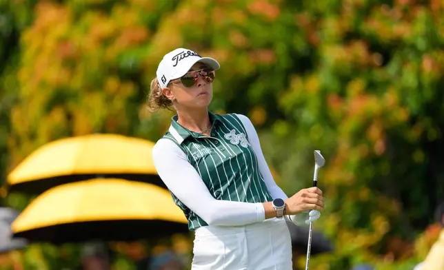 Pauline Roussin-Bouchard of France watches her shot on the 5th hole during the third day of LPGA Maybank Championship in Kuala Lumpur, Malaysia, Saturday, Oct. 31, 2026. (AP Photo/Vincent Thian)