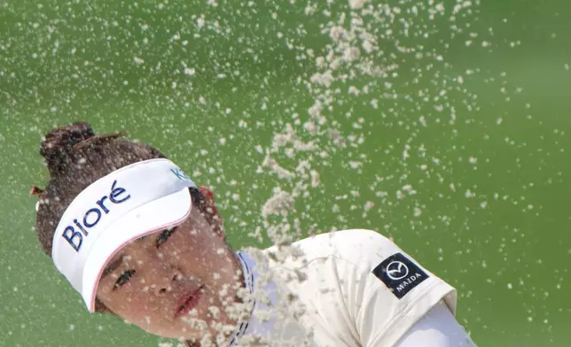 Miyu Yamashita of Japan plays a shot from a bunker during the third day of LPGA Maybank Championship in Kuala Lumpur, Malaysia, Saturday, Oct. 31, 2026. (AP Photo/David Hu)