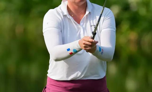 Perrine Delacour of France prepares to plays a shot on the 3rd hole during the third day of LPGA Maybank Championship in Kuala Lumpur, Malaysia, Saturday, Oct. 31, 2026. (AP Photo/Vincent Thian)