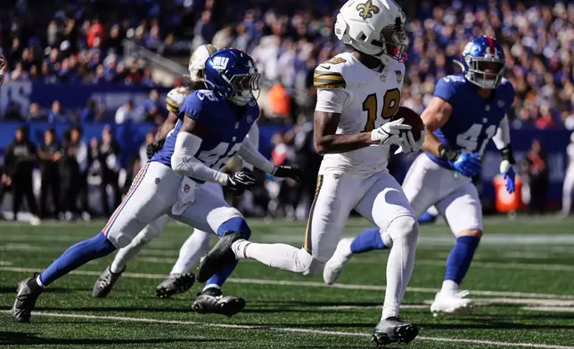 New Orleans Saints wide receiver Barion Brown (19) runs the ball during the first half of an NFL football game against the New York Giants in East Rutherford, N.J., Sunday, Oct. 18, 2026. (AP Photo/Adam Hunger)