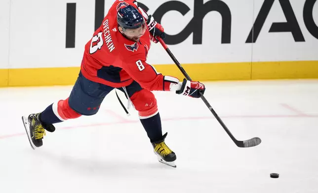 Washington Capitals left wing Alex Ovechkin shoots the puck during the third period of an NHL hockey game against the Pittsburgh Penguins, Wednesday, Oct. 7, 2026, in Washington. (AP Photo/Nick Wass)