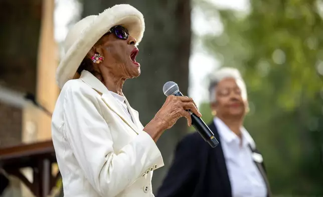Mildred Taylor Walker, a church elder, sings during a community-wide rededication ceremony of the reconstructed African Baptist Meeting House, now known as First Baptist Church of Williamsburg, in Williamsburg, Va., Friday, Oct. 9, 2026. (AP Photo/Mike Kropf)