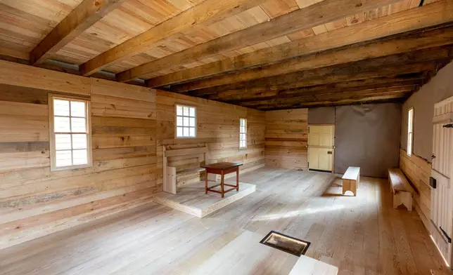 An interior view of the reconstructed African Baptist Meeting House, now known as the First Baptist Church of Williamsburg, during a rededication ceremony in Williamsburg, Va., Friday, Oct. 9, 2026. (AP Photo/Mike Kropf)