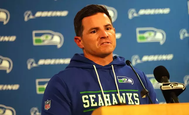 Seattle Seahawks head coach Mike MacDonald responds to reporters' questions during a news conference after an NFL football game Thursday, Oct. 15, 2026, in Denver. (AP Photo/David Zalubowski)