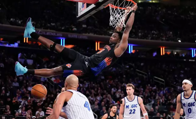 New York Knicks forward Og Anunoby (8) dunks during the first half of an NBA basketball game against the Orlando Magic, Sunday, Oct. 25, 2026, in New York. (AP Photo/Yuki Iwamura)
