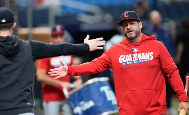 Cleveland Guardians manager Stephen Vogt arrives for batting practice before Game 2 of an American League Championship Series baseball game against the Tampa Bay Rays in St. Petersburg, Fla. Tuesday, Oct. 13, 2026. (AP Photo/David J. Phillip)