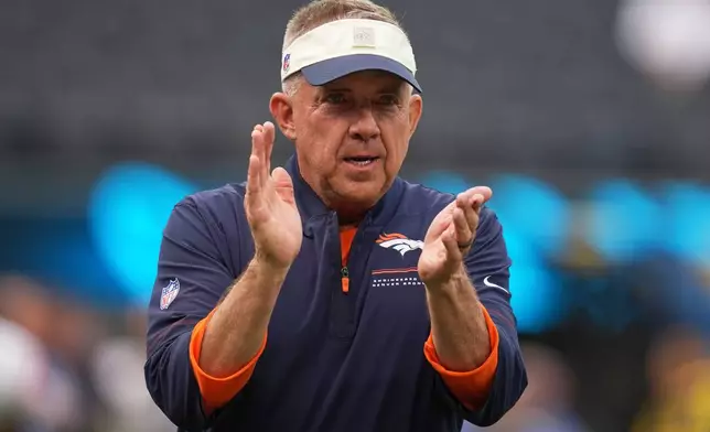 Denver Broncos head coach Sean Payton cheers his team prior to an NFL football game against the Los Angeles Chargers, Sunday, Oct. 11, 2026, in Inglewood, Calif. (AP Photo/Gregory Bull)