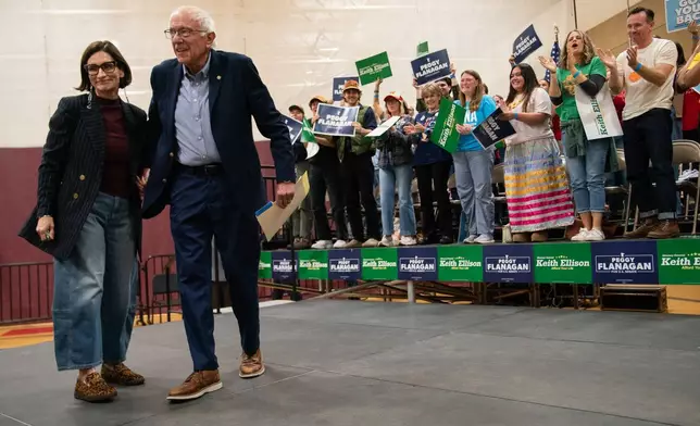 Minnesota Lt. Gov. Peggy Flanagan, left, a Democratic candidate for U.S. Senate, receives an embrace from Sen. Bernie Sanders, I-Vt., at a campaign rally Saturday, Oct. 24, 2026, at Lincoln Park Middle School in Duluth, Minn. (AP Photo/Erica Dischino)