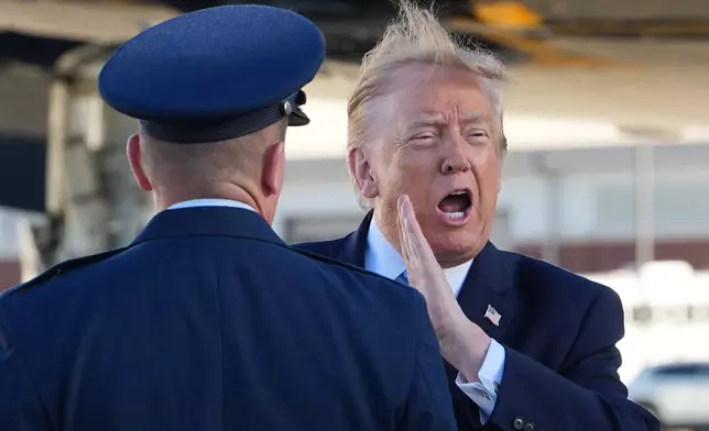 President Donald Trump yells as he arrives on Air Force One at Frederick W. Smith Airport, in Memphis, Tenn., Monday, Oct. 26, 2026, en route to a campaign rally in Mississippi. (AP Photo/Jacquelyn Martin)