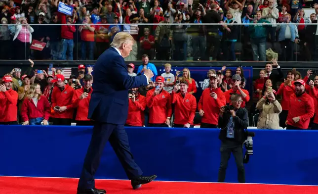President Donald Trump arrives to speak during a campaign rally at McMorran Place Sports and Entertainment Center, Sunday, Oct. 25, 2026, in Port Huron, Mich. (AP Photo/Julia Demaree Nikhinson)