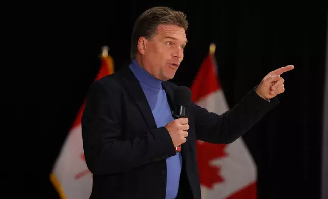 Forever Canadian founder Thomas Lukaszuk speaks at the pro-Canada watch party in Edmonton, Alberta Monday, Oct. 19, 2026. (James Maclennan/The Canadian Press via AP)