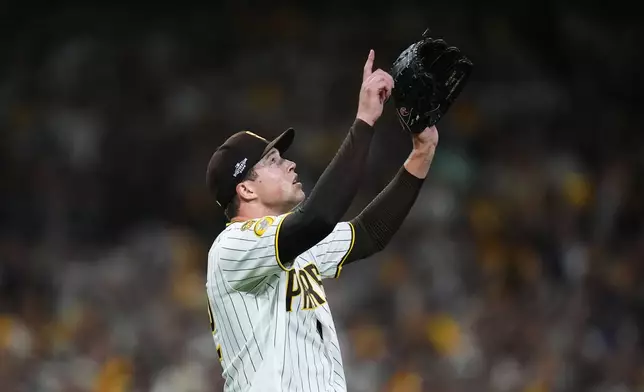 San Diego Padres pitcher Mason Miller reacts after defeating the Chicago Cubs in Game 2 of the National League Wild Card baseball playoff series Wednesday, Sept. 30, 2026, in San Diego. (AP Photo/Gregory Bull)