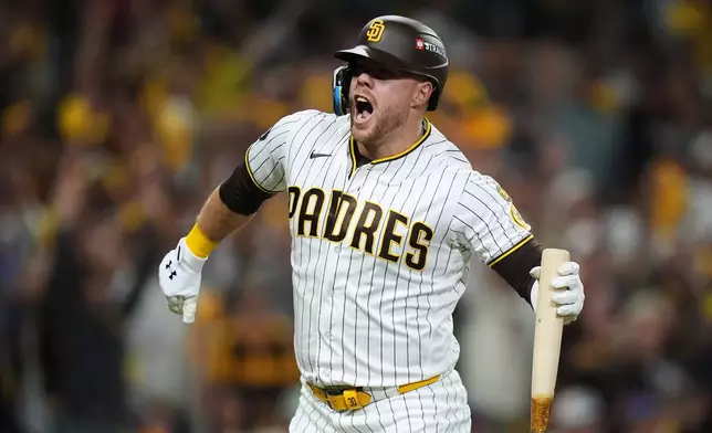 San Diego Padres Gavin Sheets celebrates his two-run home run against the Chicago Cubs in the fourth inning of Game 2 of the National League Wild Card baseball playoff series Wednesday, Sept. 30, 2026, in San Diego. (AP Photo/Gregory Bull)