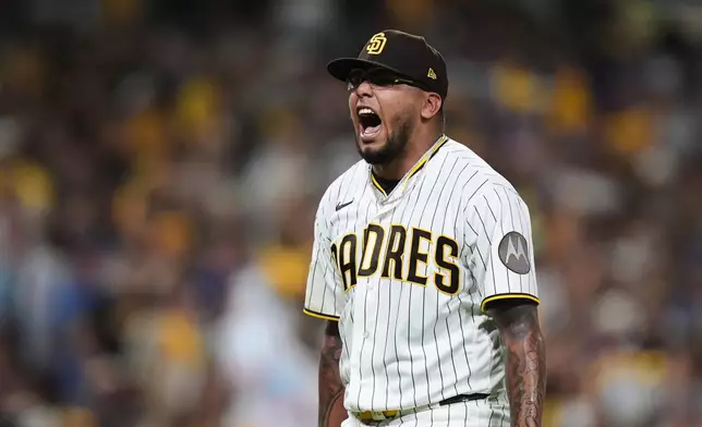 San Diego Padres pitcher Bradgley Rodriguez reacts after ending the fifth inning against the Chicago Cubs in Game 2 of the National League Wild Card baseball playoff series Wednesday, Sept. 30, 2026, in San Diego. (AP Photo/Gregory Bull)