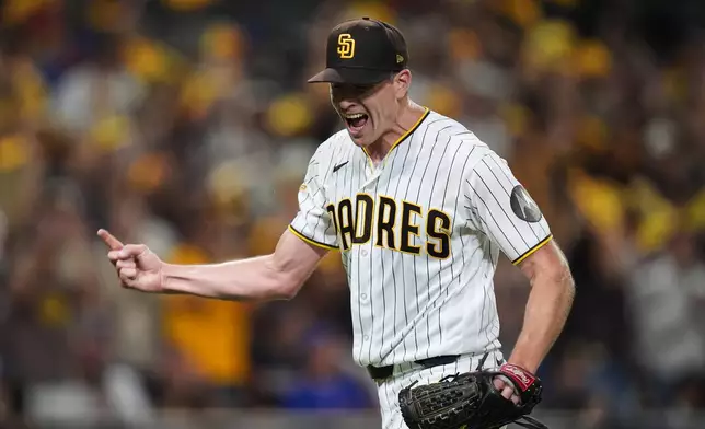 San Diego Padres pitcher Nick Pivetta reacts after ending the third inning against the Chicago Cubs in Game 2 of the National League Wild Card baseball playoff series Wednesday, Sept. 30, 2026, in San Diego. (AP Photo/Gregory Bull)