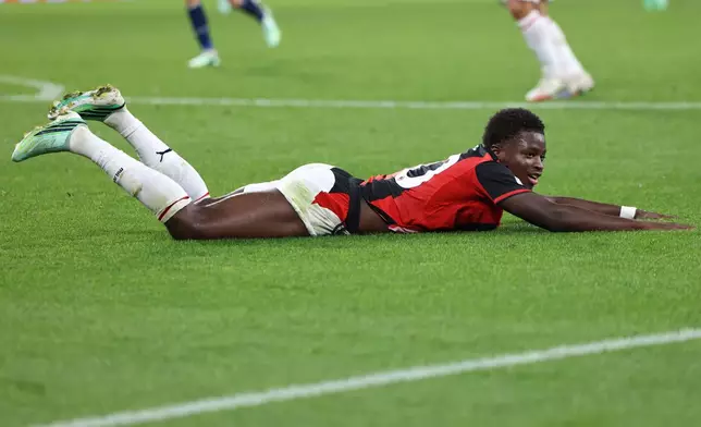 AC Milan's Alphadjo Cisse lies on the pitch during an Europa League opening phase soccer match between FC Red Bull Salzburg and AC Milan, in Salzburg, Austria, Thursday, Oct.15, 2026. (AP Photo/Alexandra Beier)
