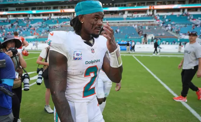 Miami Dolphins quarterback Malik Willis (2) leaves the field after an NFL football game against the Cincinnati Bengals in Miami Gardens, Fla., Sunday, Oct. 11, 2026. (AP Photo/Rebecca Blackwell)