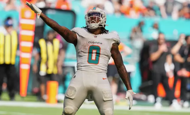 Miami Dolphins running back Ollie Gordon II (0) gestures during the second half of an NFL football game against the Cincinnati Bengals in Miami Gardens, Fla., Sunday, Oct. 11, 2026. (AP Photo/Lynne Sladky)