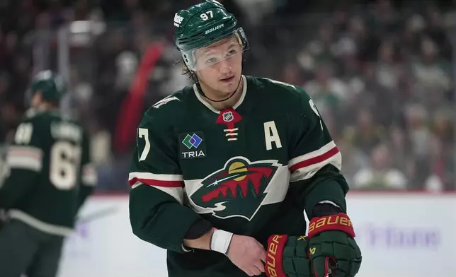 Minnesota Wild left wing Kirill Kaprizov (97) waits for play to resume during the first period of an NHL hockey game against the Columbus Blue Jackets, Sunday, Oct. 18, 2026, in St. Paul, Minn. (AP Photo/Abbie Parr)