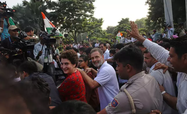 India's opposition Congress party leader Rahul Gandhi, center, and his sister, fellow lawmaker Priyanka Gandhi Vadra, lead opposition party leaders and workers in a march toward the Supreme Court demanding the resignation of Chief Election Commissioner Gyanesh Kumar in New Delhi, India, Monday, Oct. 12, 2026. (AP Photo/Prabhat Mehrotra)