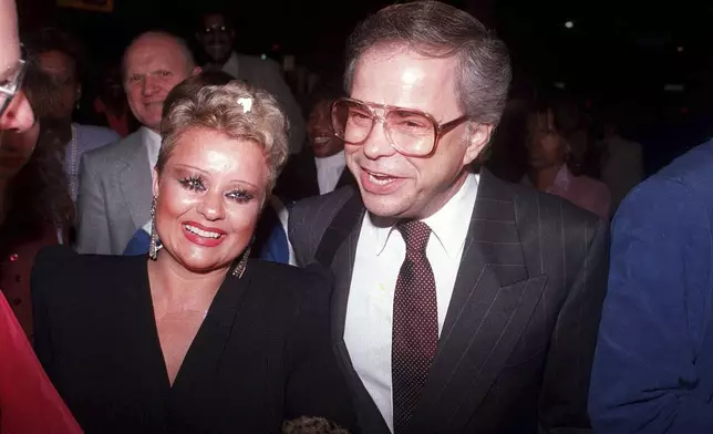 File - Jim and Tammy Bakker enjoy a night on the town night of Oct. 24, 1987 as they arrive at the Beverly Theatre to see the show "The Gospel Truth." (AP Photo/Douglas C. Pizac, File)