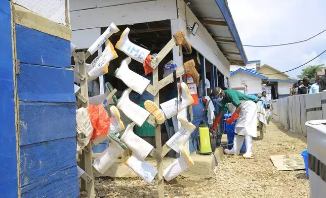 Protective boots worn by healthcare workers are left to dry after getting disinfected inside a treatment center for Ebola patients in Beni, North Kivu province, eastern Congo, Tuesday, Oct. 27, 2026. (AP Photo/Sebastien Kitsa Musayi)