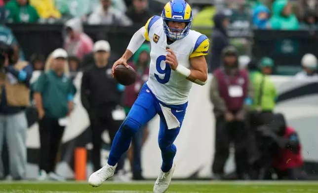 Los Angeles Rams quarterback Matthew Stafford runs with the ball during the second half of an NFL football game against the Philadelphia Eagles in Philadelphia, Sunday, Oct. 4, 2026. (AP Photo/Matt Slocum)