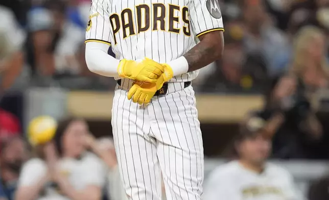 San Diego Padres' Samad Taylor pauses after striking out to end the seventh inning in Game 4 of baseball's National League Division Series against the Milwaukee Brewers Wednesday, Oct. 7, 2026, in San Diego. (AP Photo/Gregory Bull)