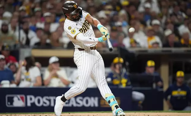 San Diego Padres' Fernando Tatis Jr. hits a home run against the Milwaukee Brewers during the third inning in Game 4 of baseball's National League Division Series Wednesday, Oct. 7, 2026, in San Diego. (AP Photo/Gregory Bull)