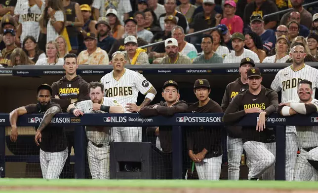 San Diego Padres players watch from the dugout during the seventh inning in Game 4 of baseball's National League Division Series Wednesday, Oct. 7, 2026, in San Diego. (AP Photo/Derrick Tuskan)