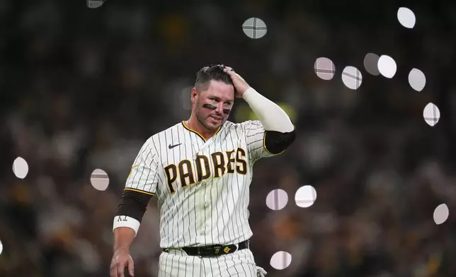 San Diego Padres' Ty France reacts after he was forced out by Milwaukee Brewers second baseman Brice Turang during the sixth inning in Game 4 of baseball's National League Division Series Wednesday, Oct. 7, 2026, in San Diego. (AP Photo/Gregory Bull)