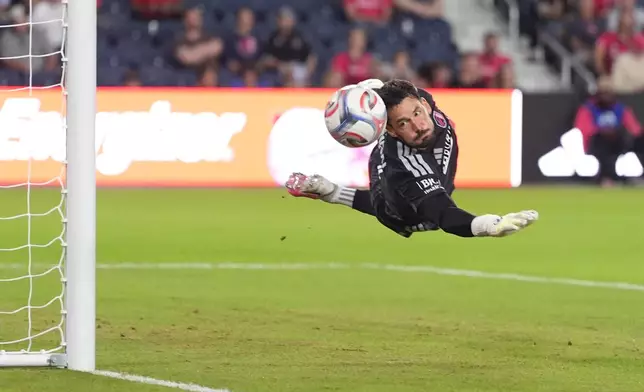 St. Louis City goalkeeper Roman Bürki deflects a shot during the first half of an MLS soccer match against the Vancouver Whitecaps Wednesday, Oct. 14, 2026, in St. Louis. (AP Photo/Jeff Roberson)