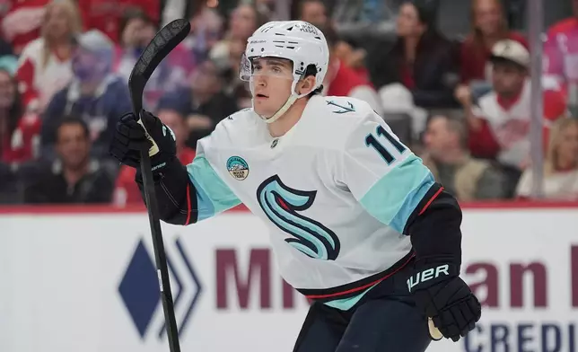 Seattle Kraken right wing Mackie Samoskevich (11) celebrates his goal against the Detroit Red Wings in the second period of an NHL hockey game Friday, Oct. 9, 2026, in Detroit. (AP Photo/Paul Sancya)