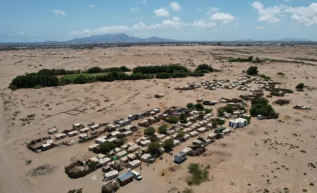 An aerial view shows the Al-Salam camp, which shelters displaced Yemenis, in Dar Saad district, Aden, Yemen, Tuesday, Oct. 6, 2026. (AP Photo/Abdulnasser Alseddik)